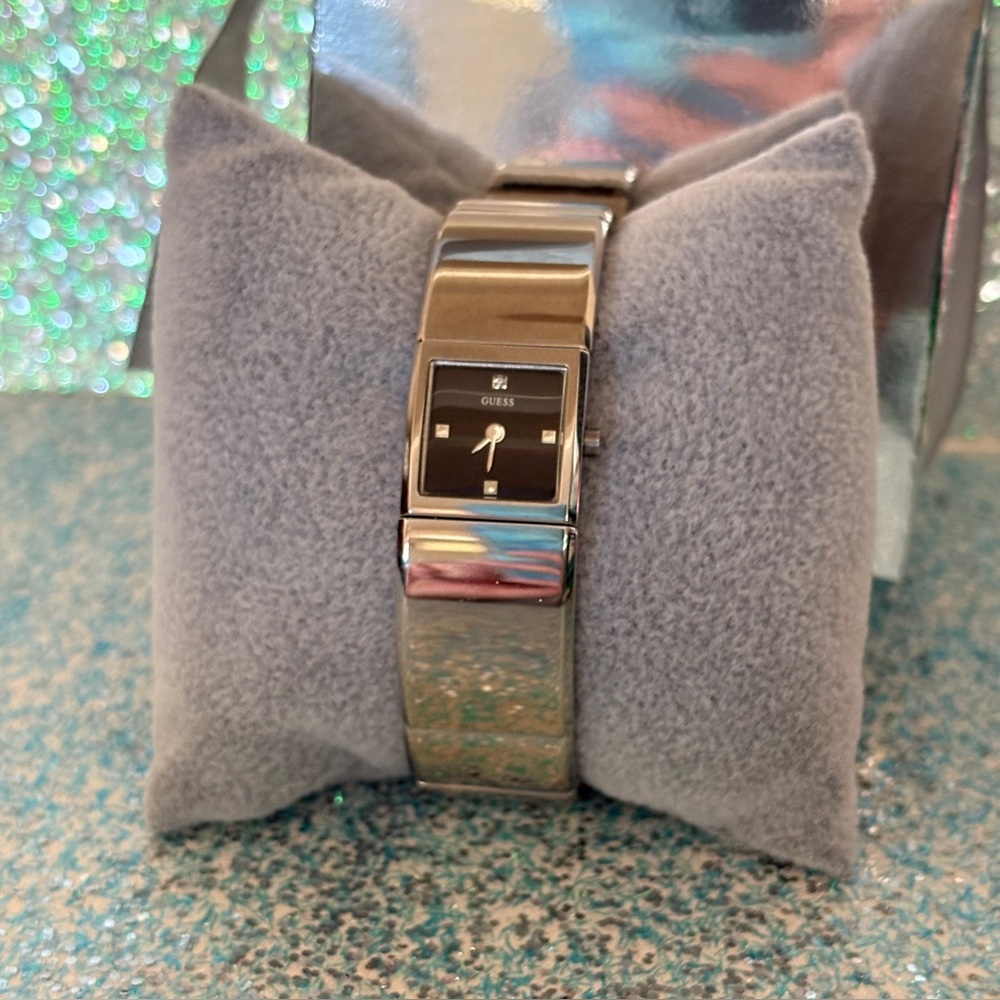 Vintage Guess Silver Watch with Minimalist Design and Integrated Cuff Band
